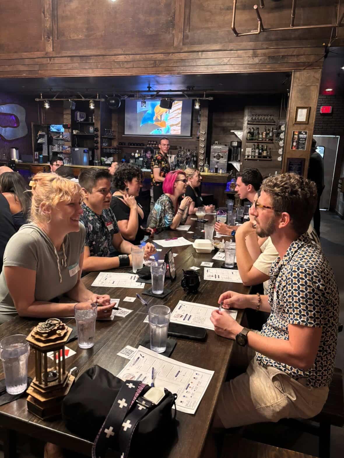 A busy Critical Match table with guests, cards, and tabletop details.